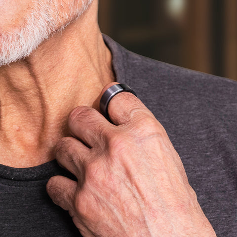 Close up of older adult man with Lotus Ring 